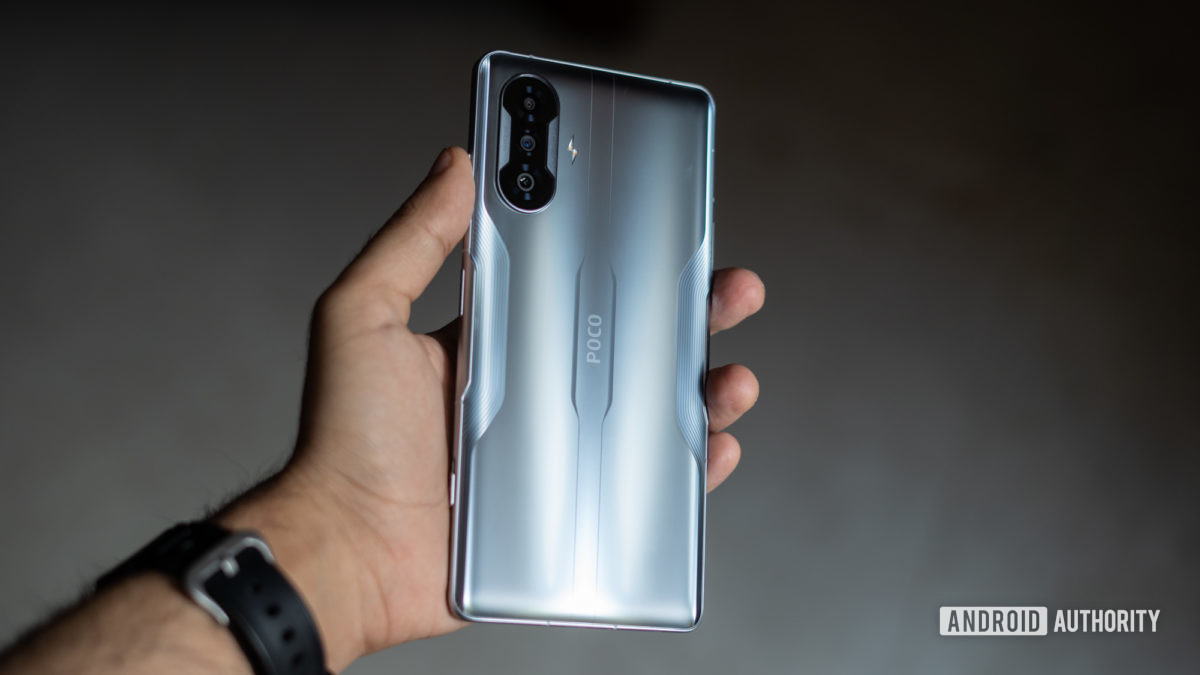 Poco F3 GT showing back of phone in hand