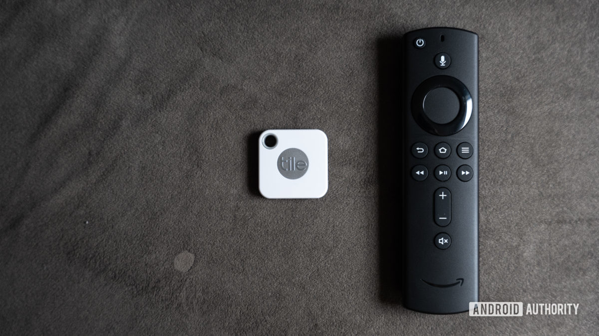 The Tile Mate Tracker next to a remote.