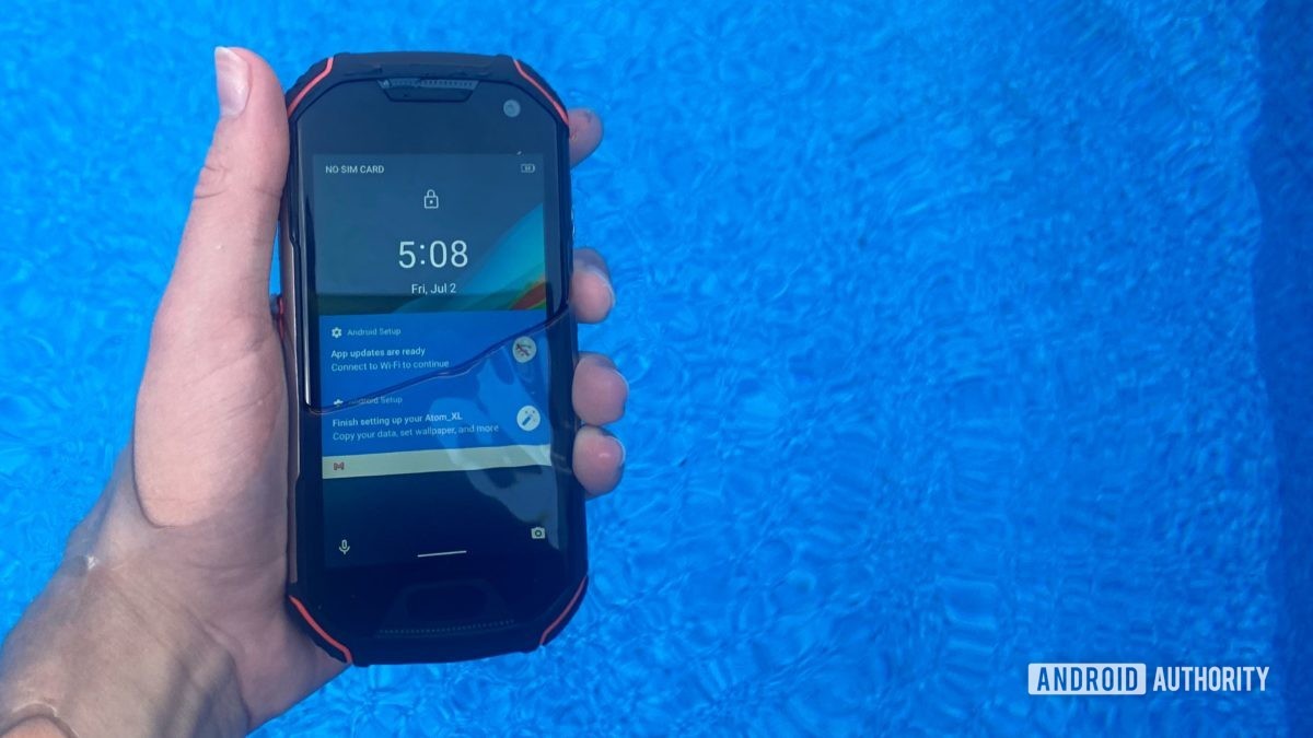 The Unihertz Atom XL in water showing waterproof capability.