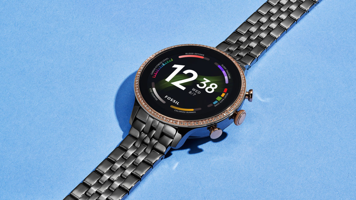 The Fossil Gen 6 Smartwatch with a stainless steel strap on a table.