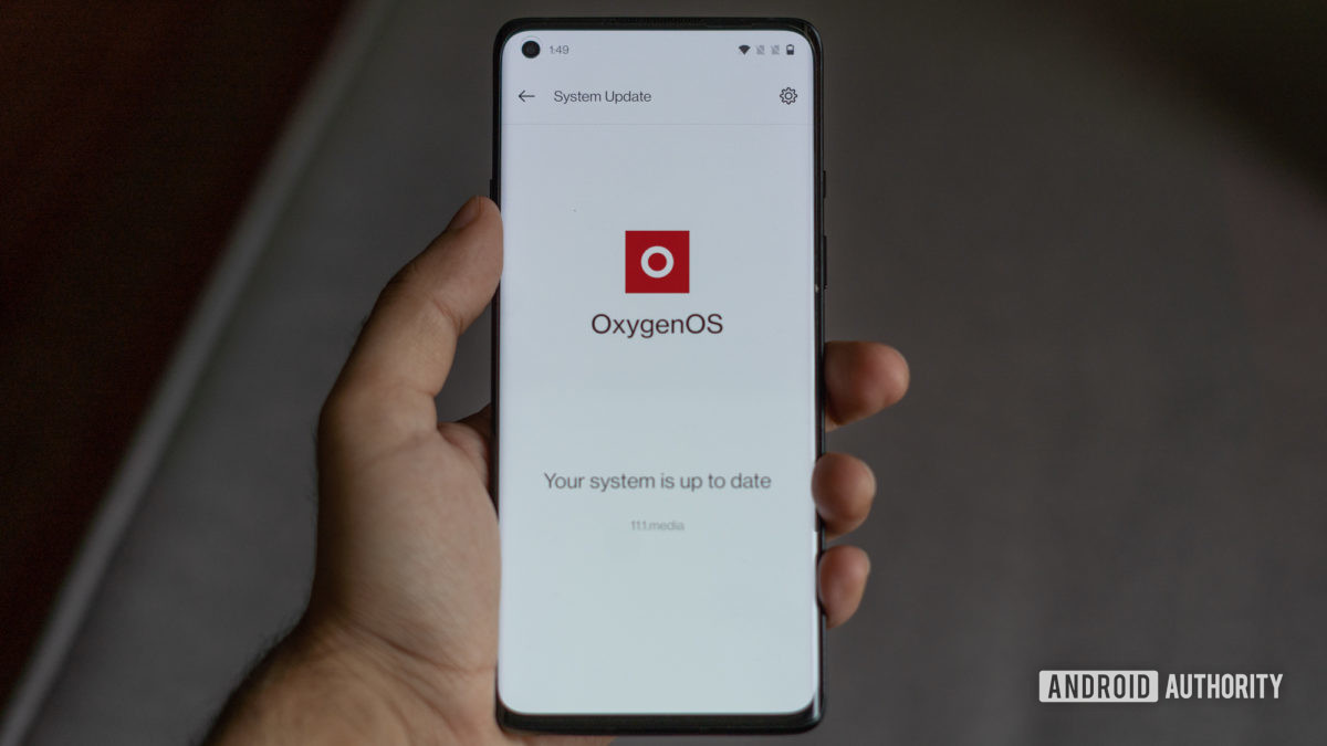 OnePlus Oxygen OS 11 Android 11 on phone in hand.