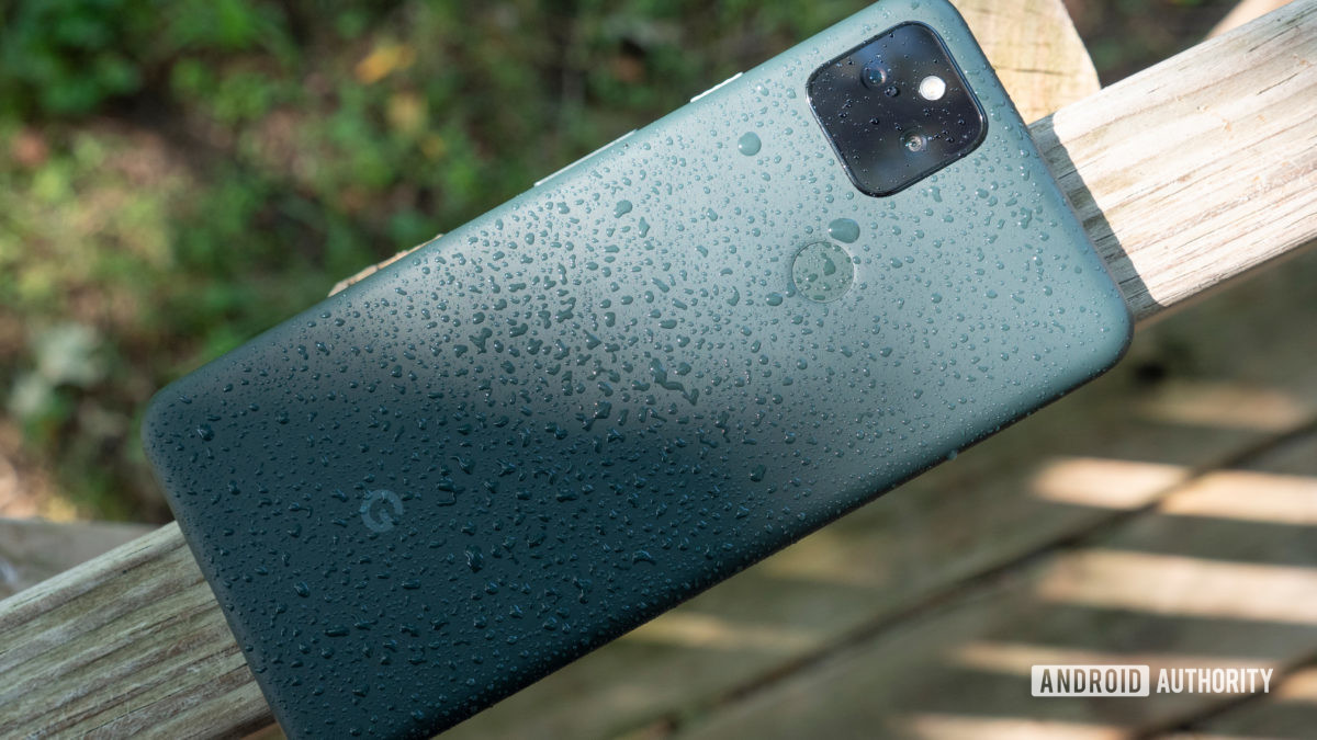 the google pixel 5a on a bench with water splashed droplets