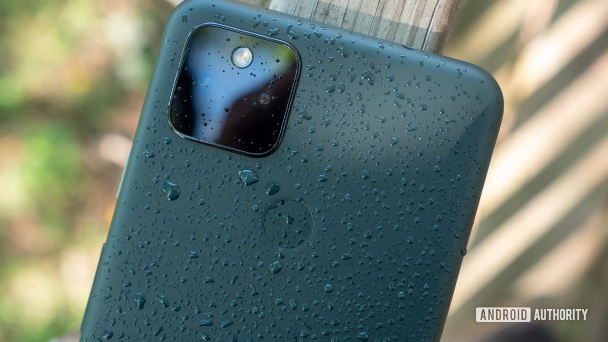 the google pixel 5a on a bench with water splashed droplets