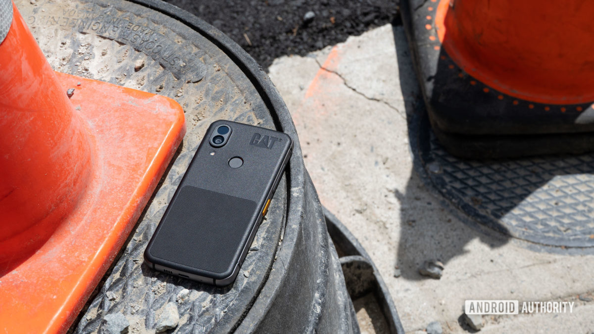 Cat S62 Pro outside next to a traffic cone.