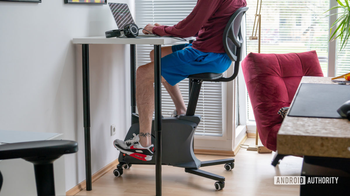 Flexispot Sit2Go Pro fitness chair desk cycle man cycling at desk while seated