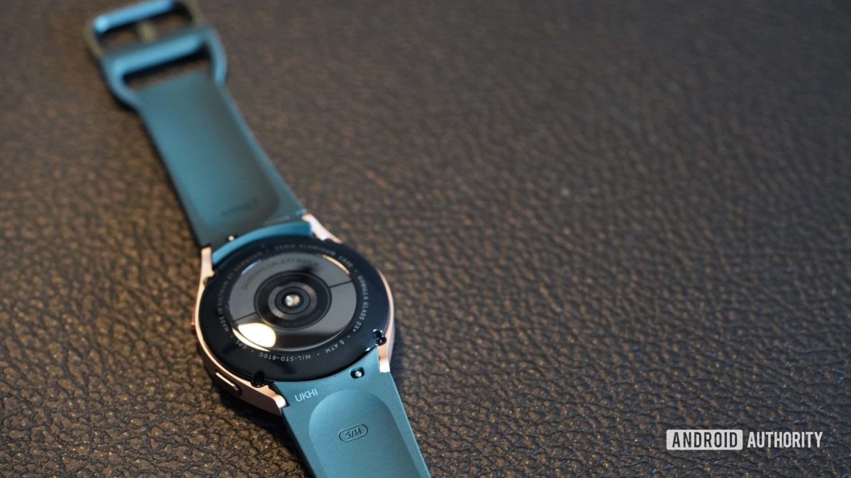 Samsung Galaxy Watch 4 rests face down, exposing the band's spring bar.