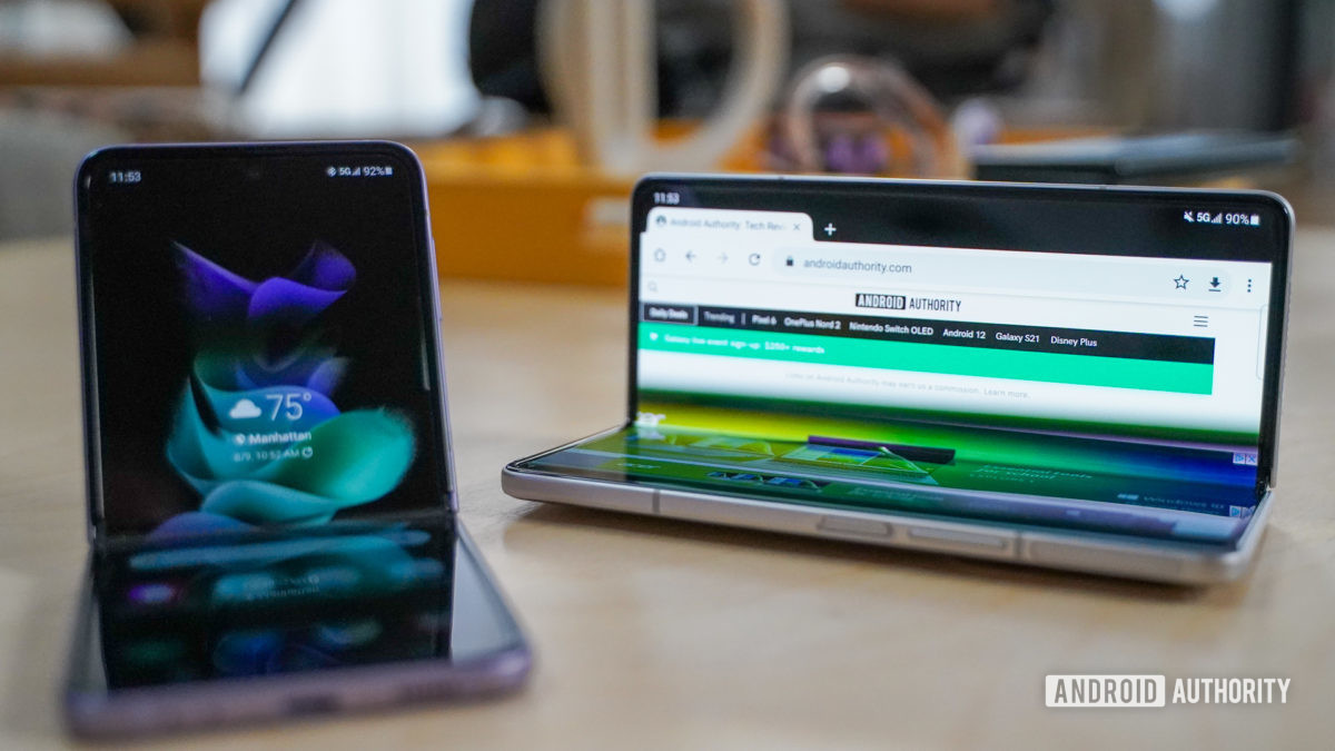 Samsung Galaxy Fold 3 and Flip 3 sitting open Samsung Galaxy Fold 3 and Flip 3 sitting open