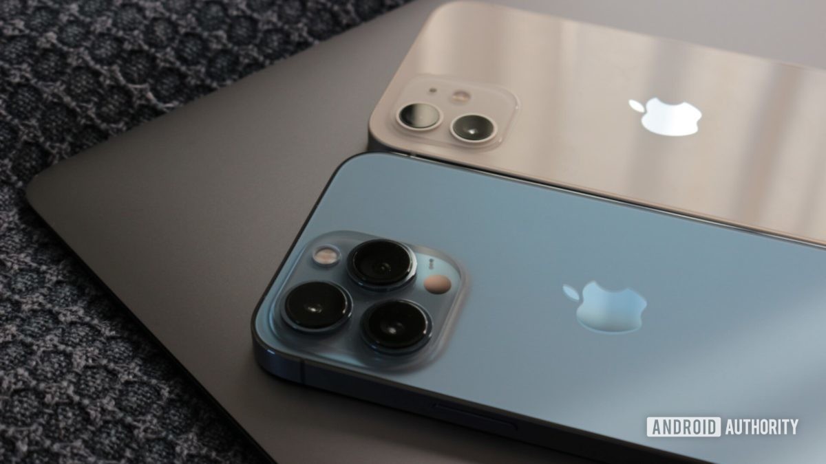 iPhone 13 Pro and iPhone 12 on Macbook Air close up