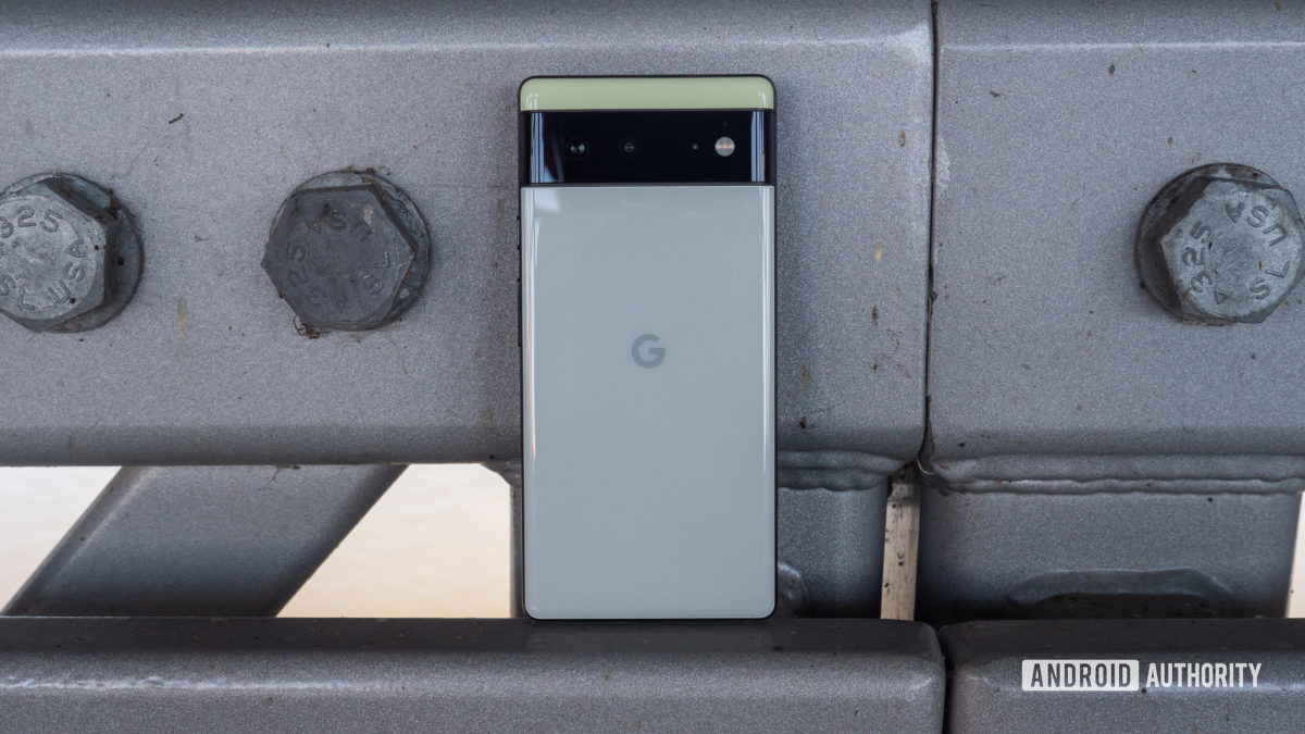 The Google Pixel 6 in Sorta Seafoam color resting on a bridge