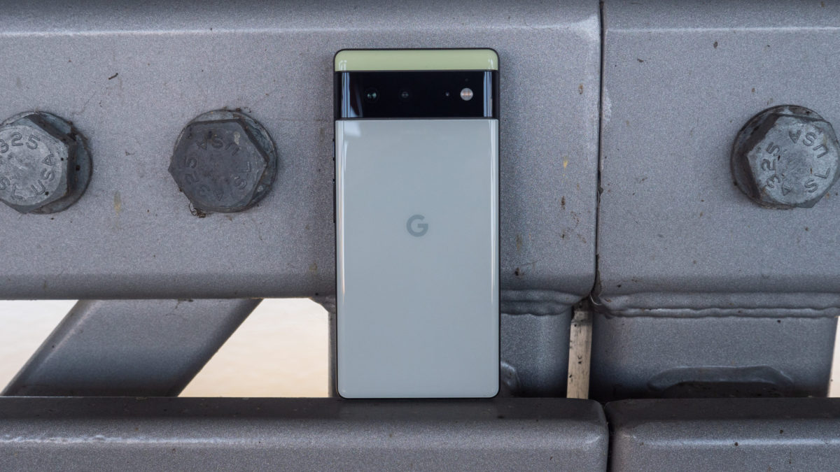 The Google Pixel 6 in Sorta Seafoam color resting on a bridge