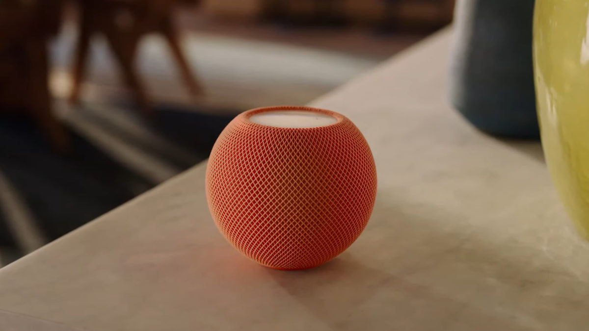 A HomePod mini in orange