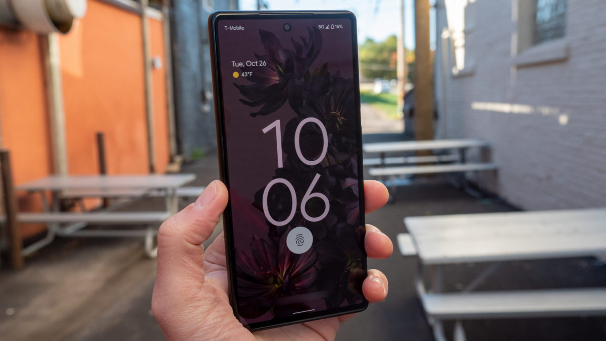 The Google Pixel 6 in Sorta Seafoam color in hand showing the lock screen and display