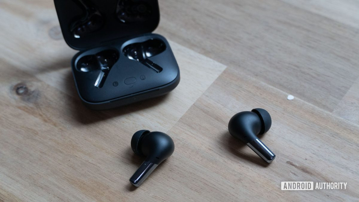 OnePlus Buds Pro laying on a table.