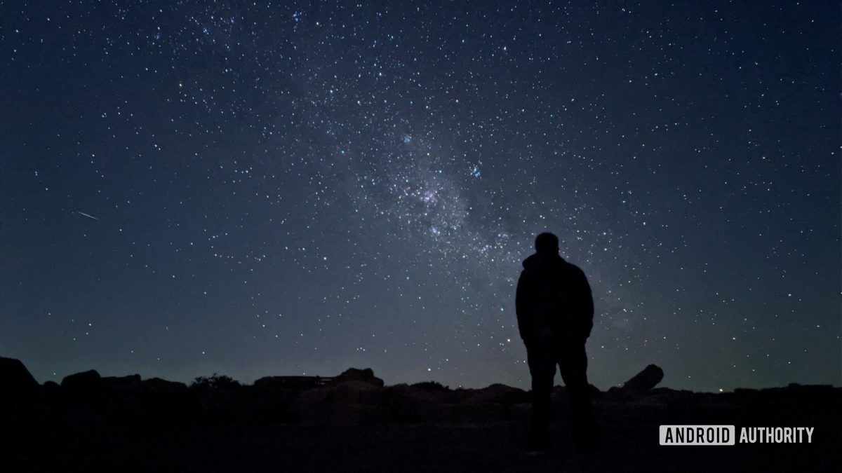 Pixel 4 astrophotography mode in Sutherland showing a man silhouetted against the night sky with stars.