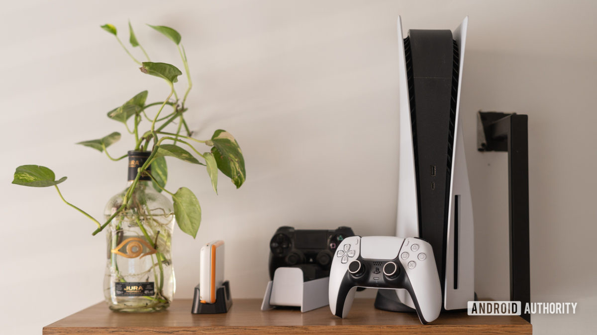 PlayStation 5 console next to controllers on a table