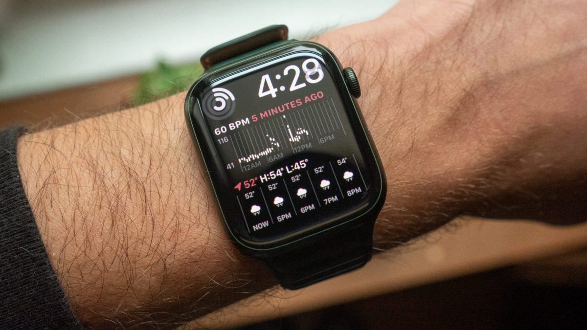 An Apple Watch Series 7 on a user's wrist displays the Modular Duo watch face.