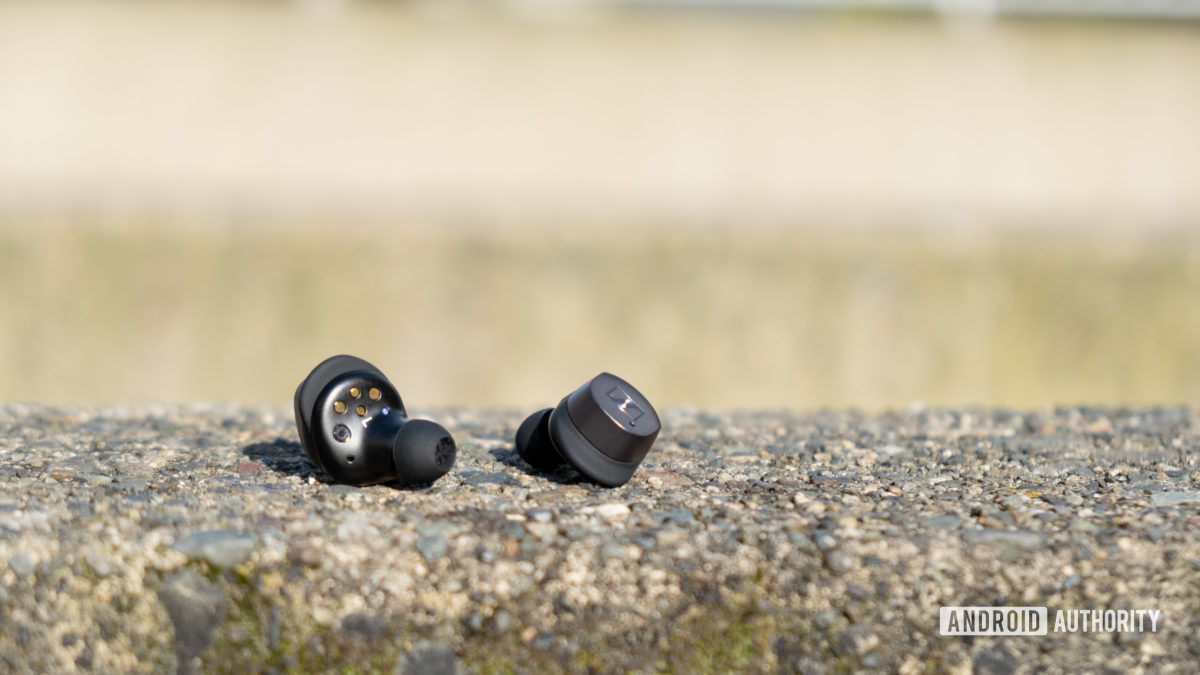 Sennheiser momentum true wireless 3 buds on concrete.