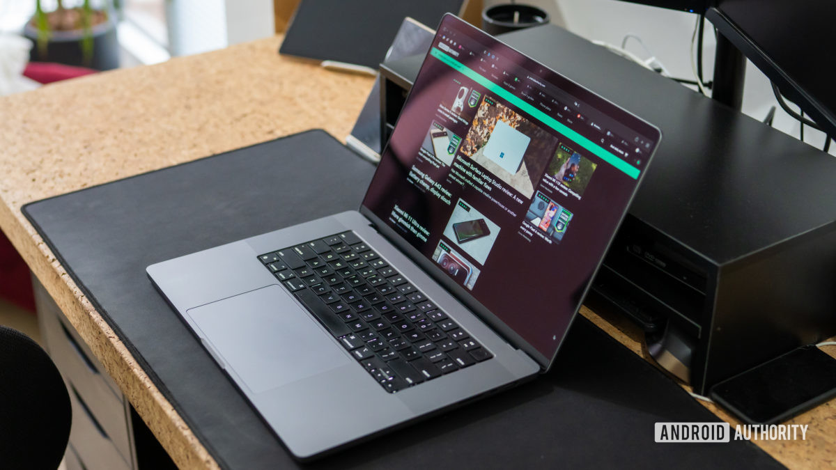 Apple MacBook Pro 2021 review laptop open on desk Apple MacBook Pro 2021 review laptop open on desk