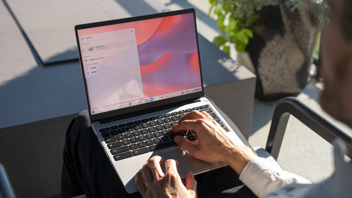 hands typing on laptop