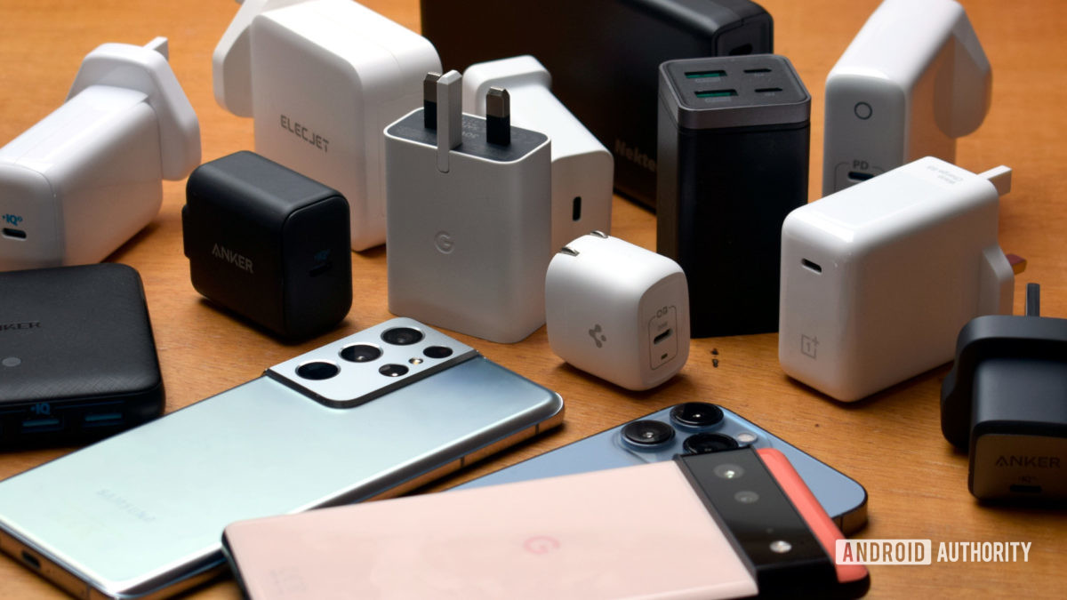 Galaxy iPhone and Pixel smartphones with selection of chargers