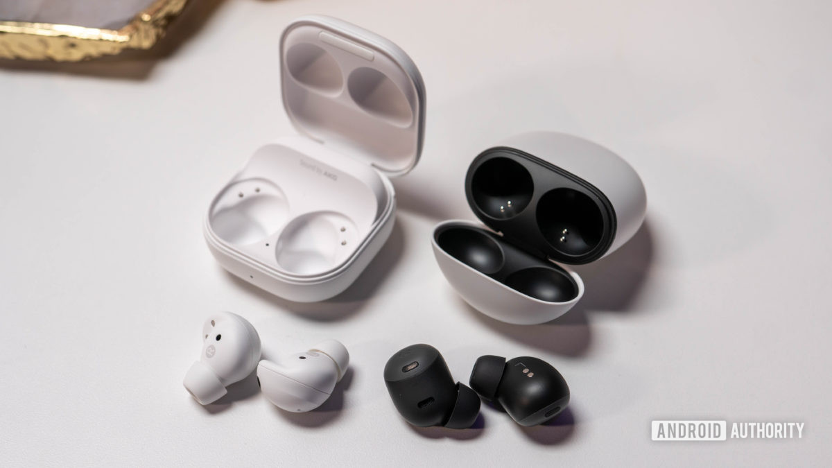 Samsung Galaxy Buds 2 Pro vs Pixel Buds Pro laying next to charging cases