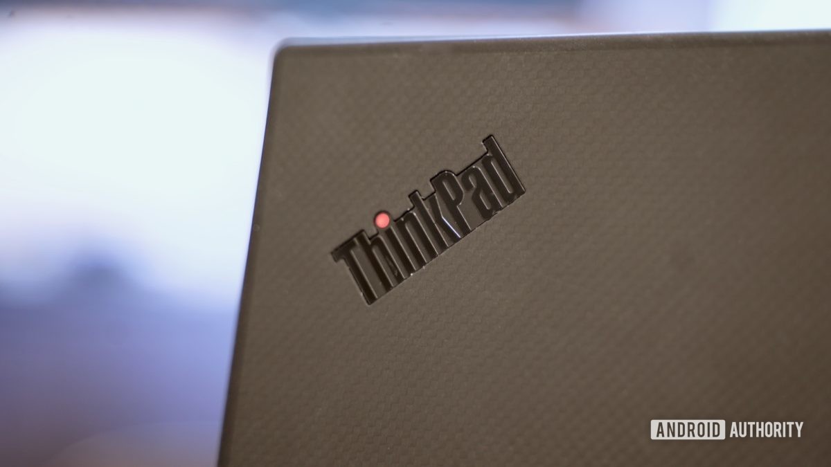 Lenovo ThinkPad X1 Carbon review logo closeup with red dot