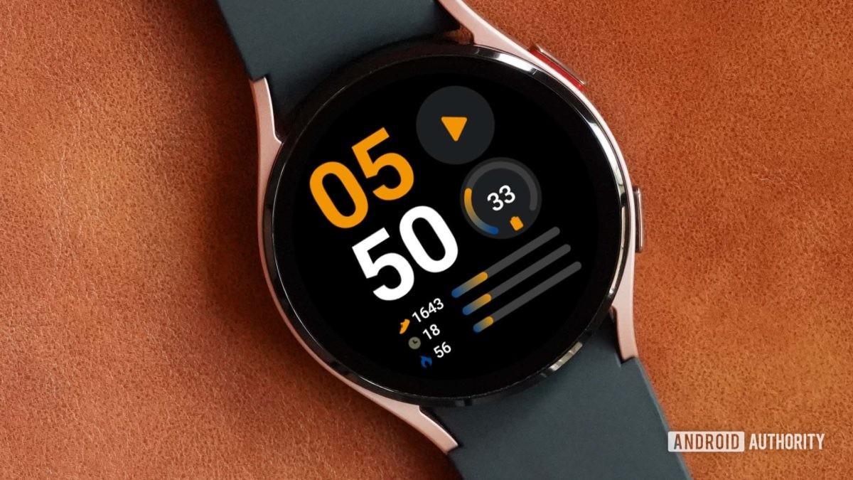 A Samsung Galaxy Watch 4 on a leather surface displays the watch face Info Brick.