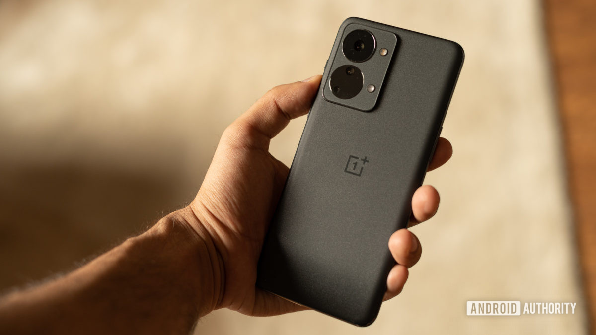 OnePlus Nord 2T in hand showing back of the phone