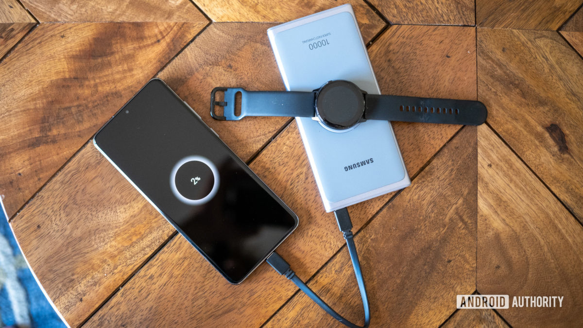 samsung super fast power bank on table with watch