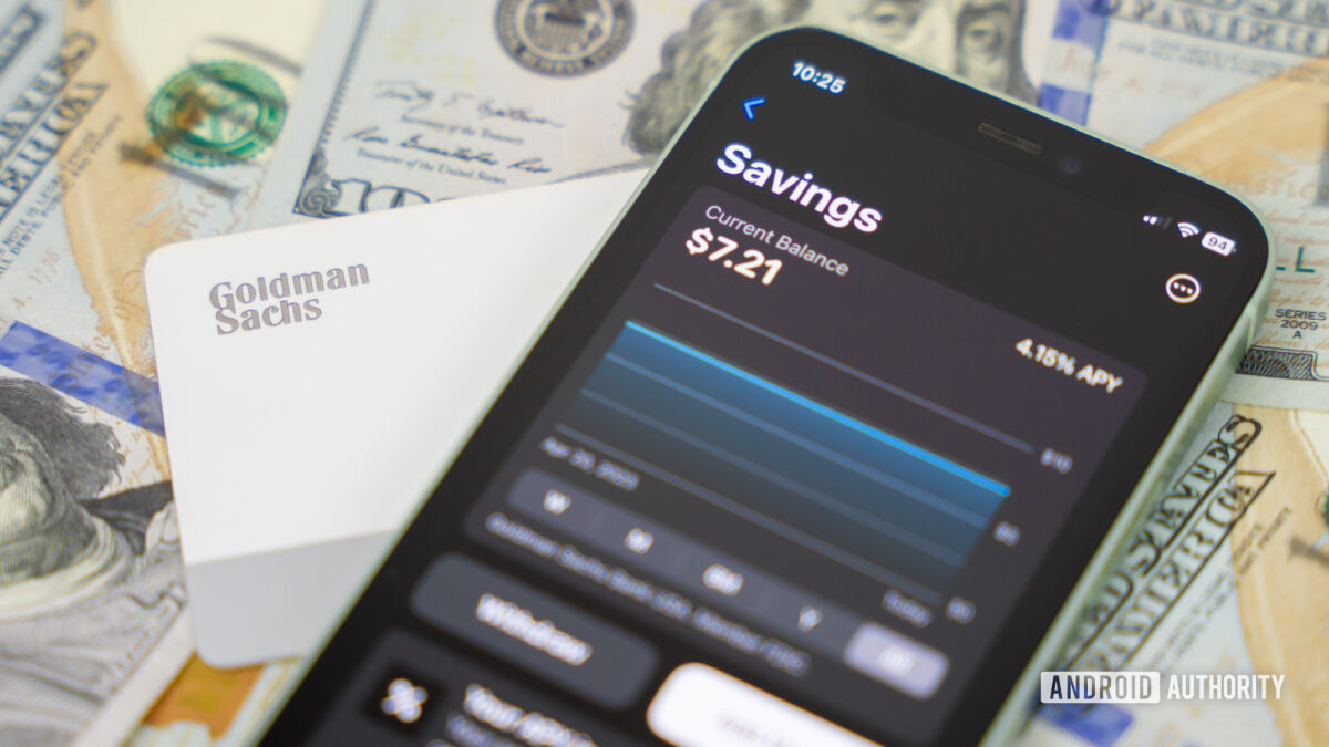 Stock photo of Apple Card Savings account next to Apple Card and bills 6 Stock photo of Apple Card Savings account next to Apple Card and bills 6