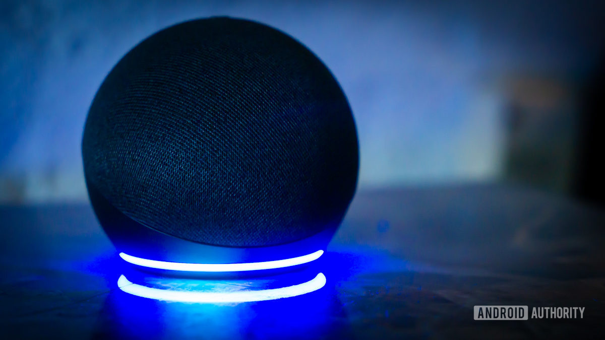 Amazon Echo Dot Alexa speaker with light ring turned on stock photo 1