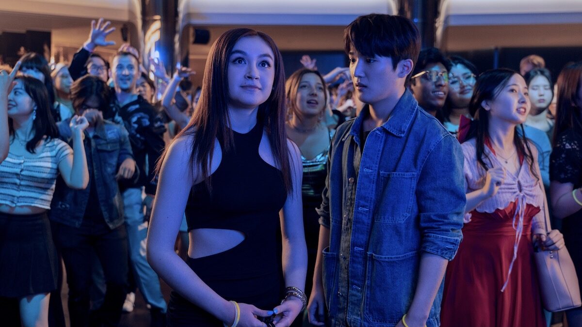 Anna Cathcart as Kitty Song Covey and Choi Min-yeong as Dae stand together at a school dance in XO, Kitty