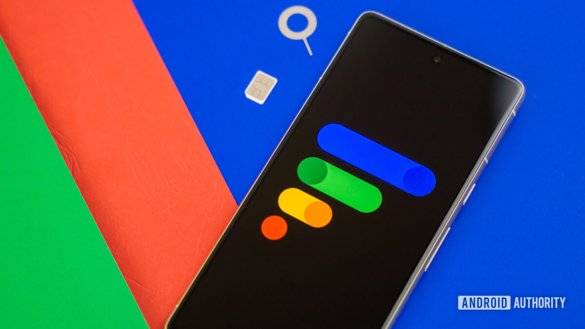 Google Fi Wireless logo on smartphone with SIM card and SIM ejector next to it Stock photo 7