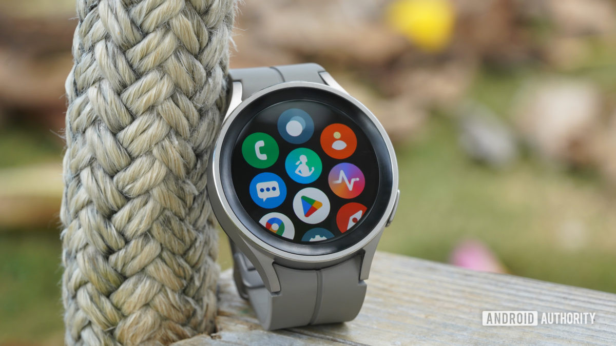 A Samsung Galaxy Watch 5 Pro displays its App Library including Google and Samsung native apps.