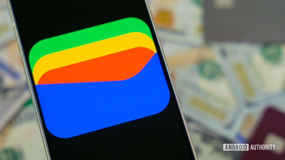 Google Wallet logo on smartphone next to credit cards and cash Stock photo 12