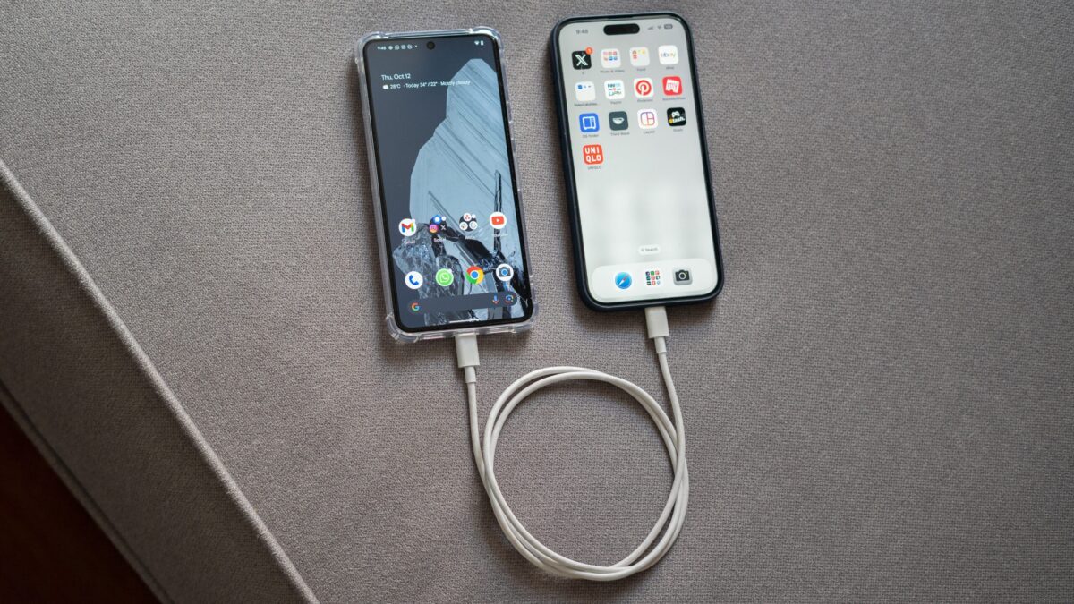 Pixel 8 Pro vs iPhone 15 Pro Max connected over USB top down view