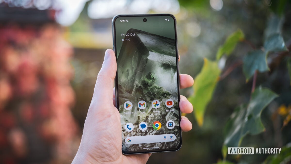 Google Pixel 8 homescreen in hand outdoors