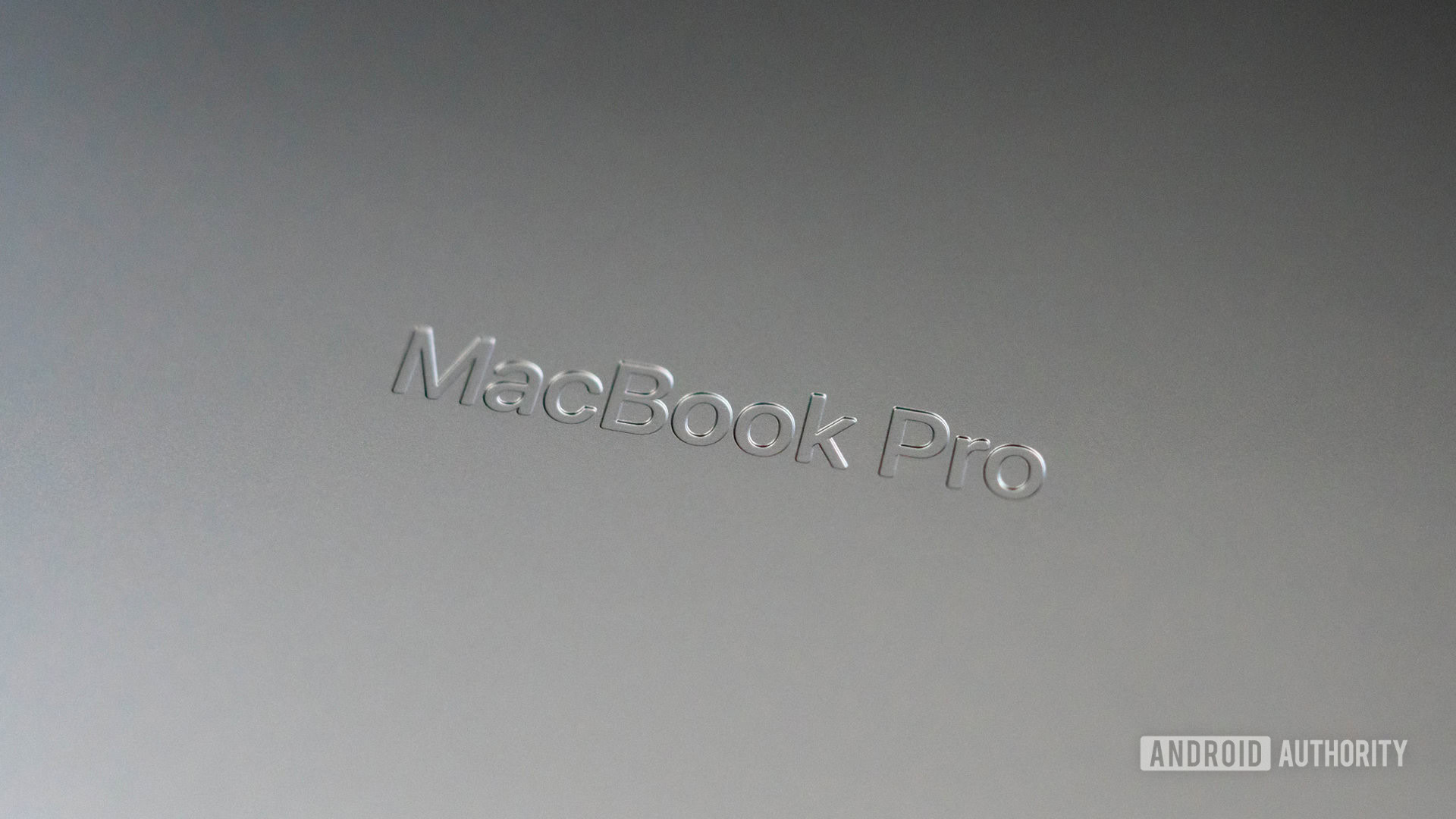 Apple MacBook Pro 2023 debossed logo on underside