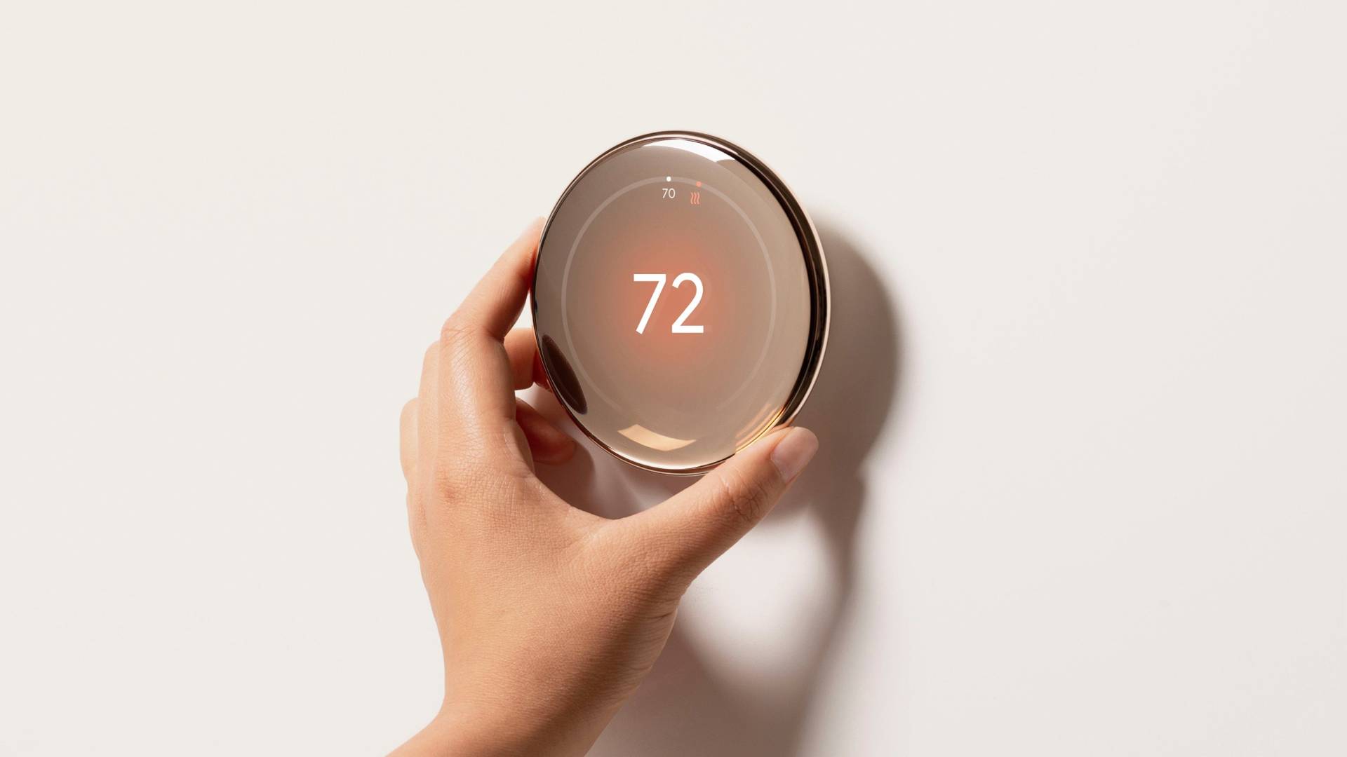 Leaked image showing a hand interacting with the fourth-gen Nest Learning Thermostat.