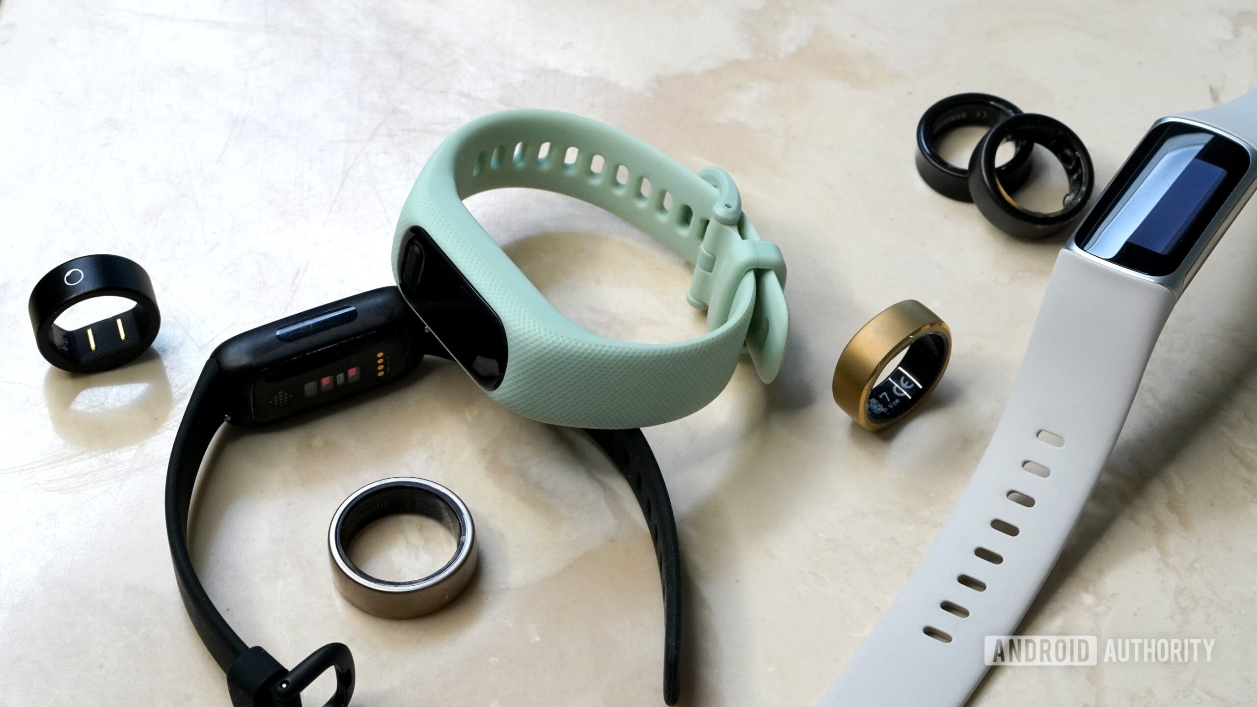 A variety of smart rings rest among popular fitness trackers.