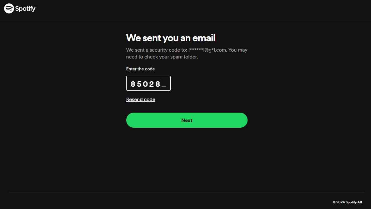 Spotify 2FA screen with security code being entered