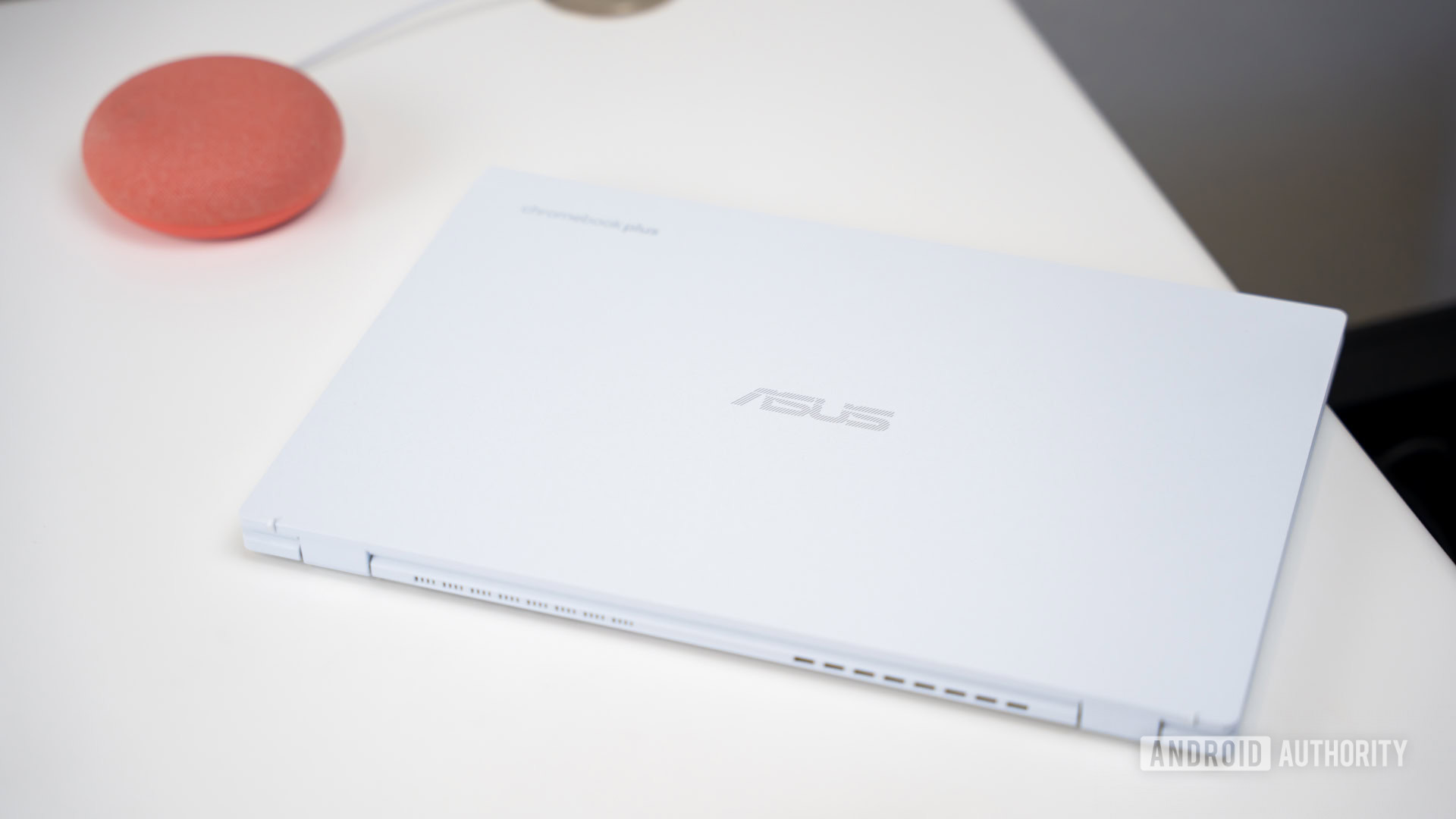 ASUS Chromebook Plus CX34 laptop on desk stock photo (1)