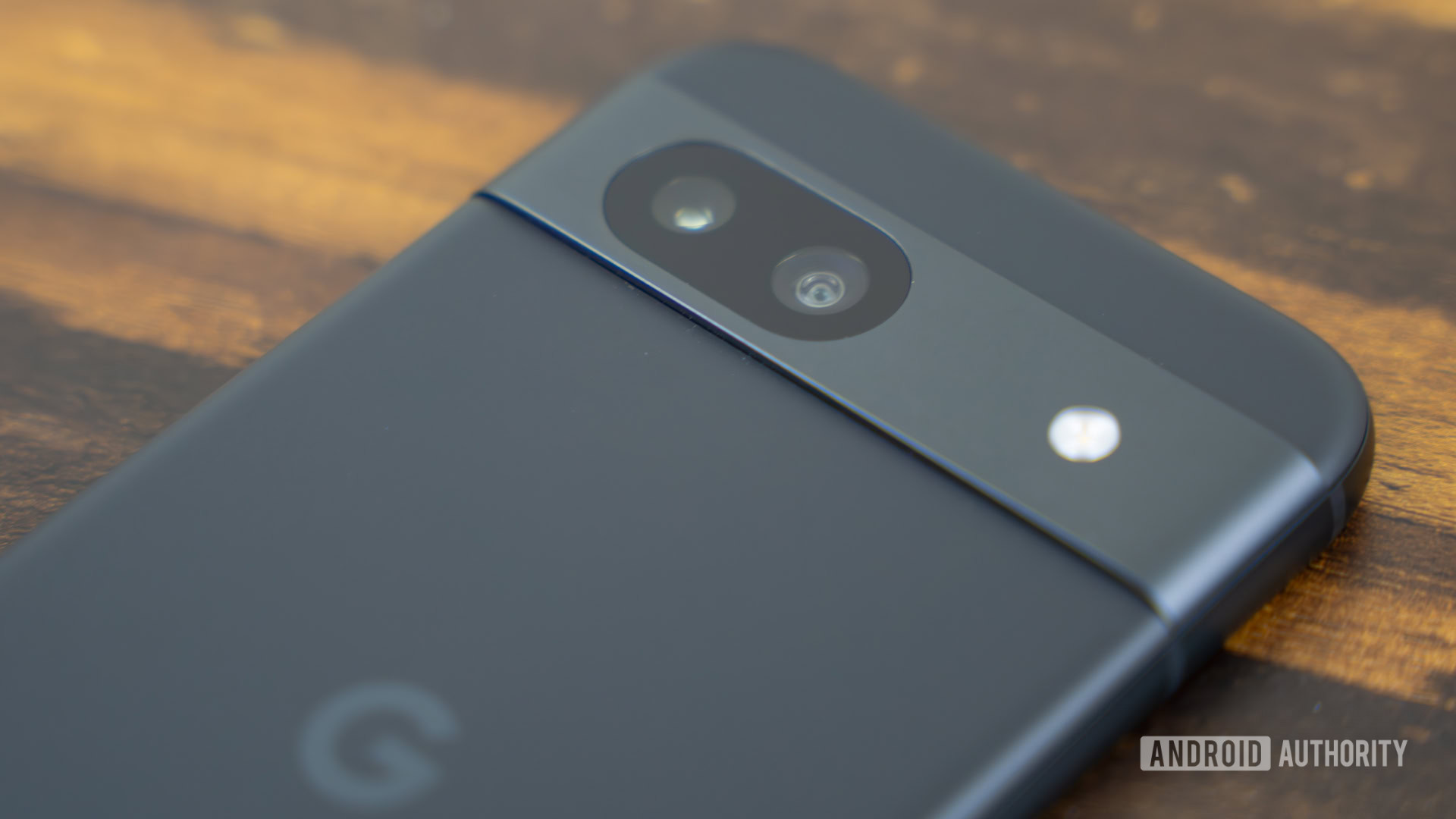 Google Pixel 8a laying on table, showing the back stock photo (4)