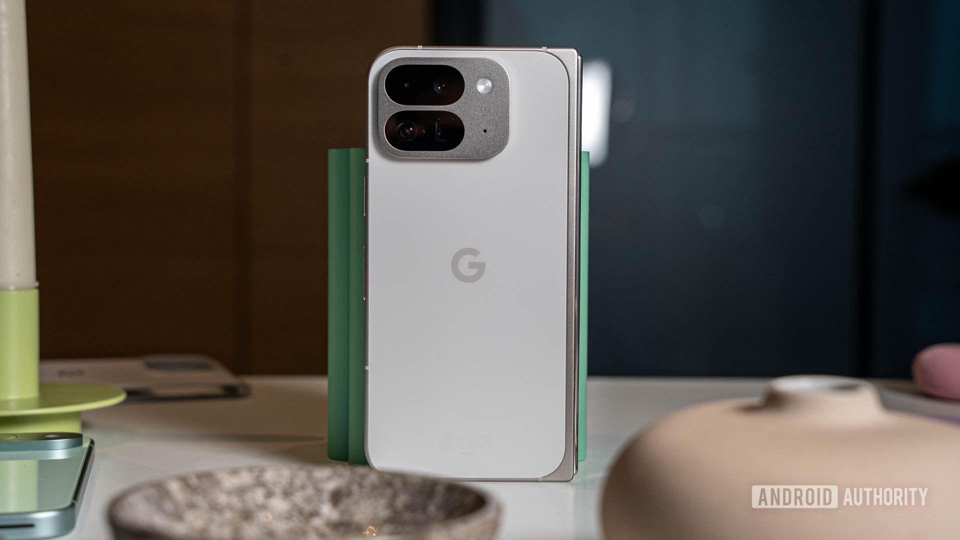 Google Pixel 9 Pro Fold in Porcelain color, standing on a table in its folded state