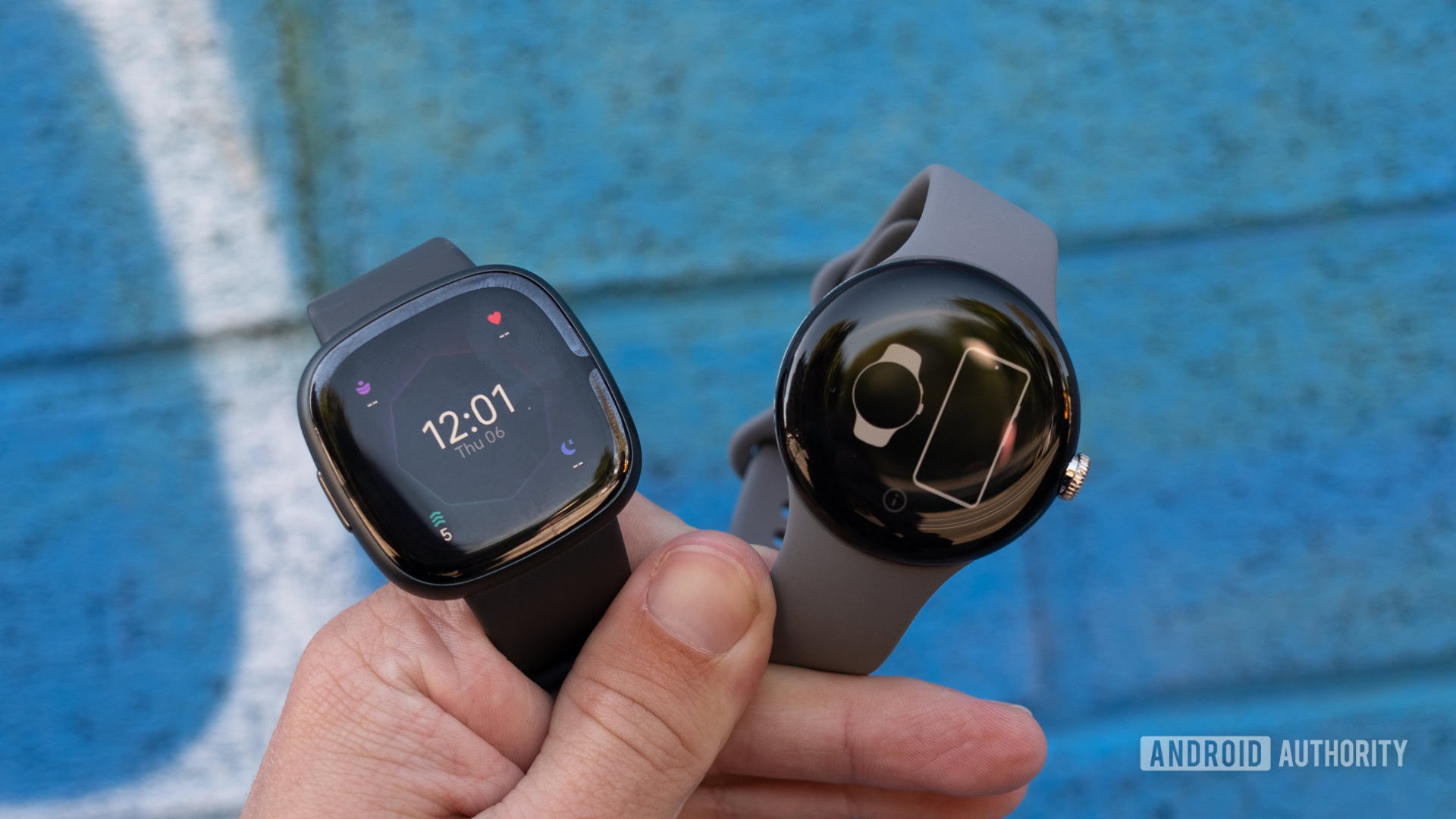 fitbit sense 2 vs google pixel watch held below