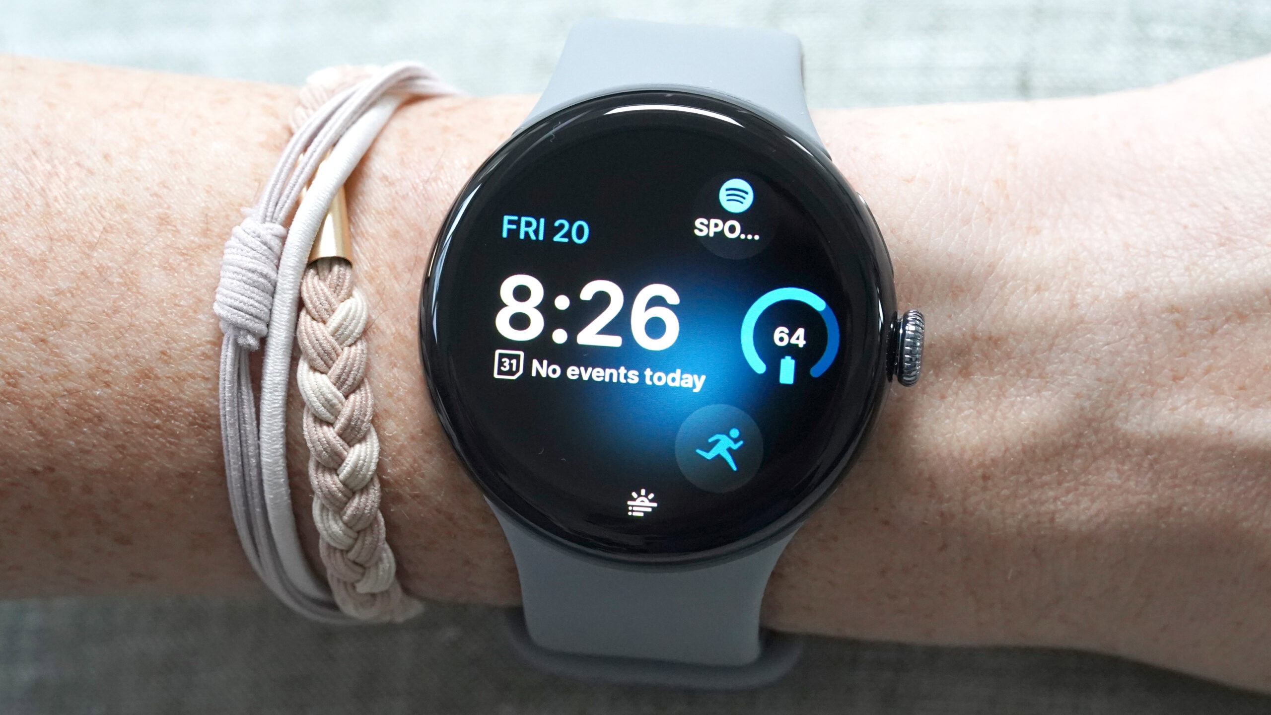 A Google Pixel Watch 3 displays a watch face with a Morning Brief Notification at the bottom.