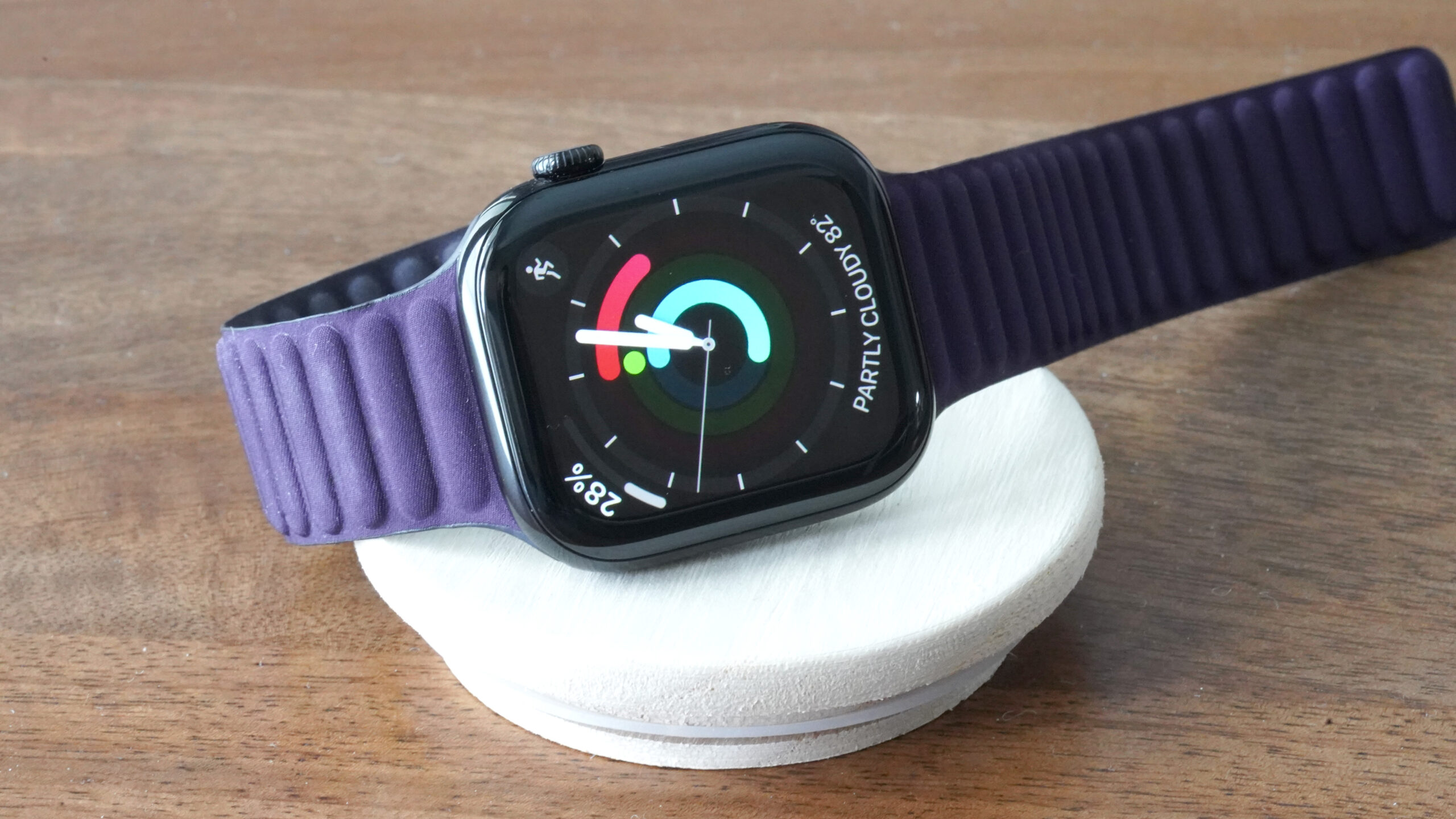 An Apple Watch Series 10 displays the watch face Activity Analog