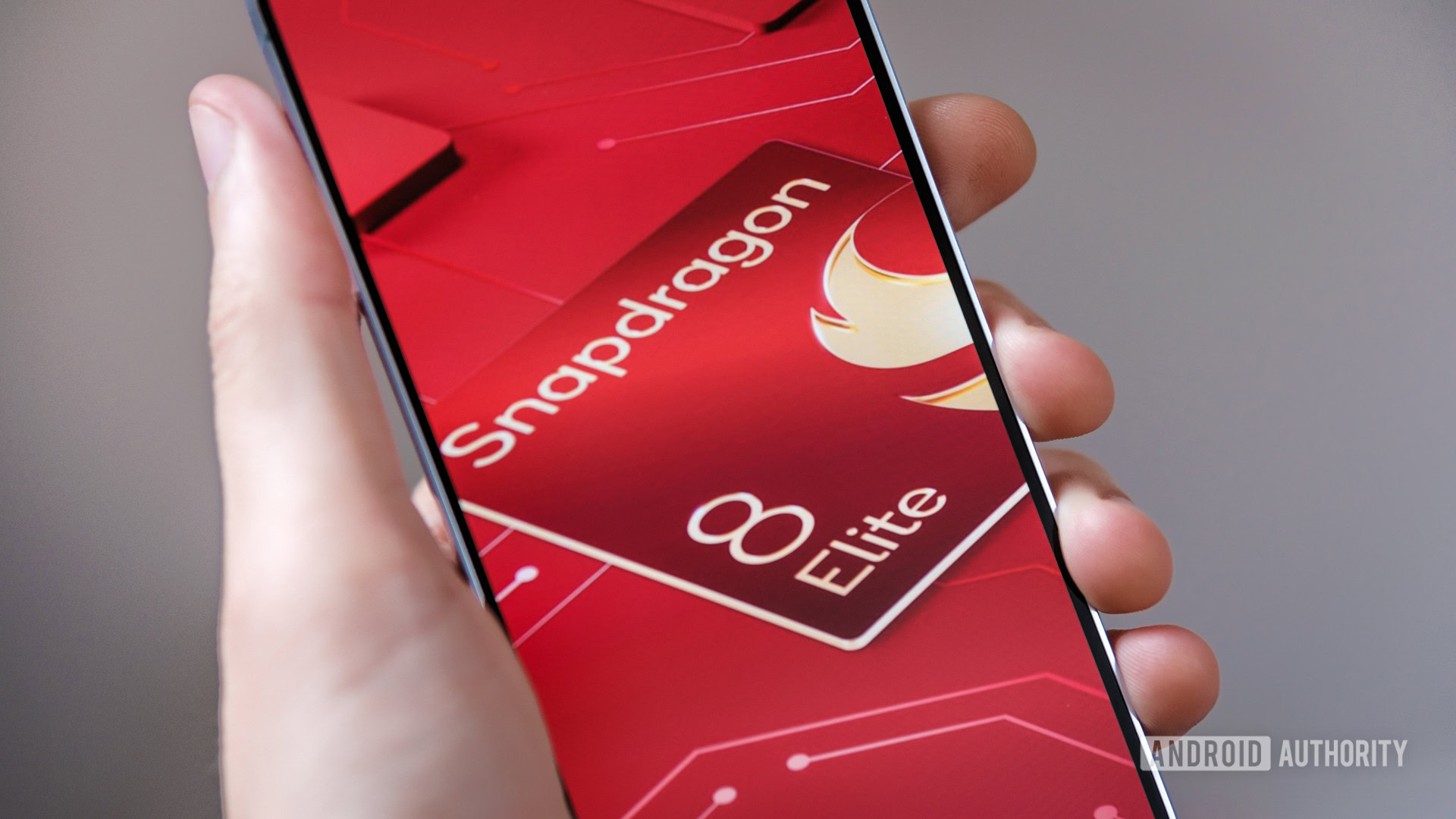 Snapdragon 8 Elite logo in hand