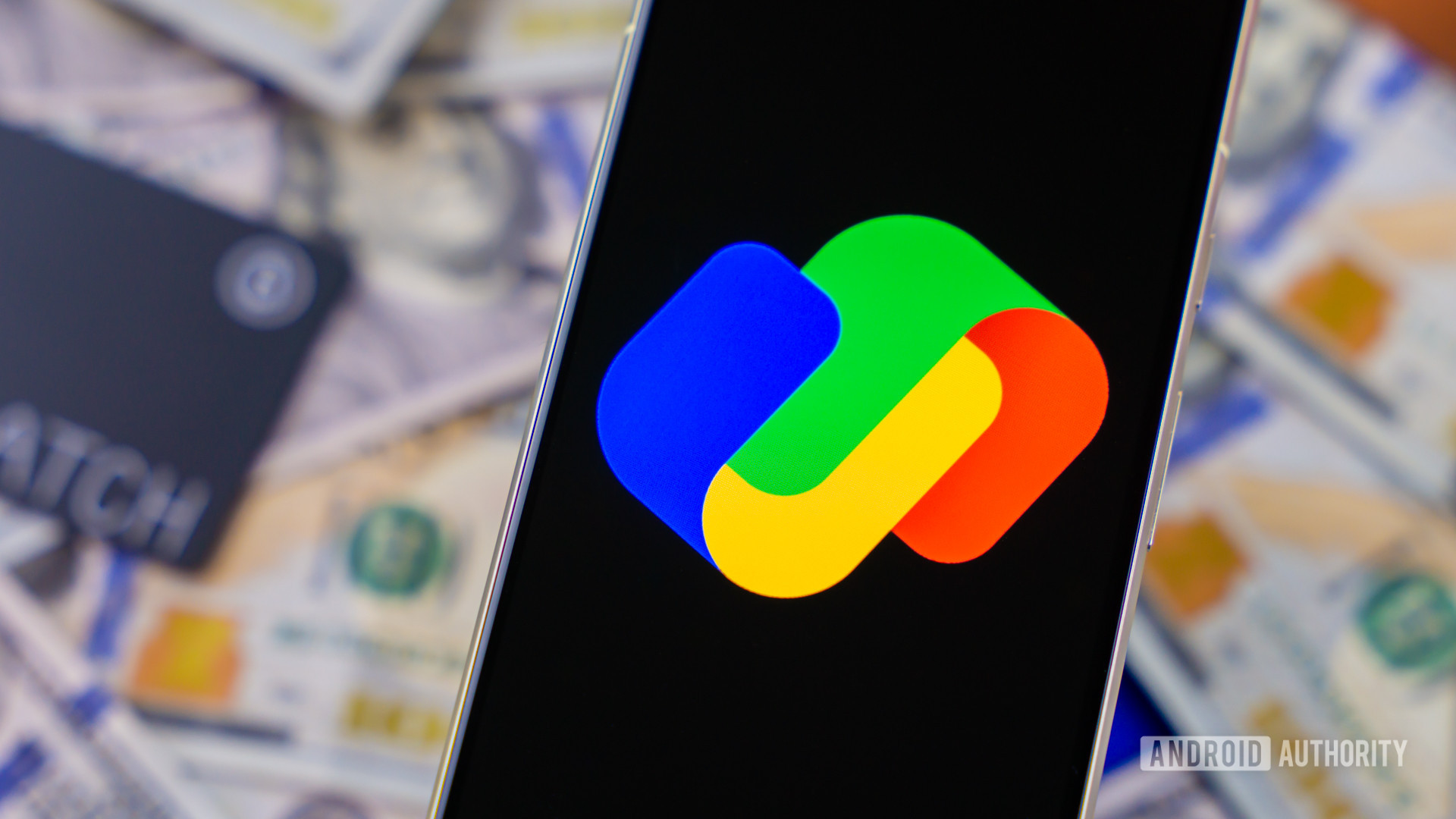 Google Pay logo on smartphone next to money and cards Stock photo 1