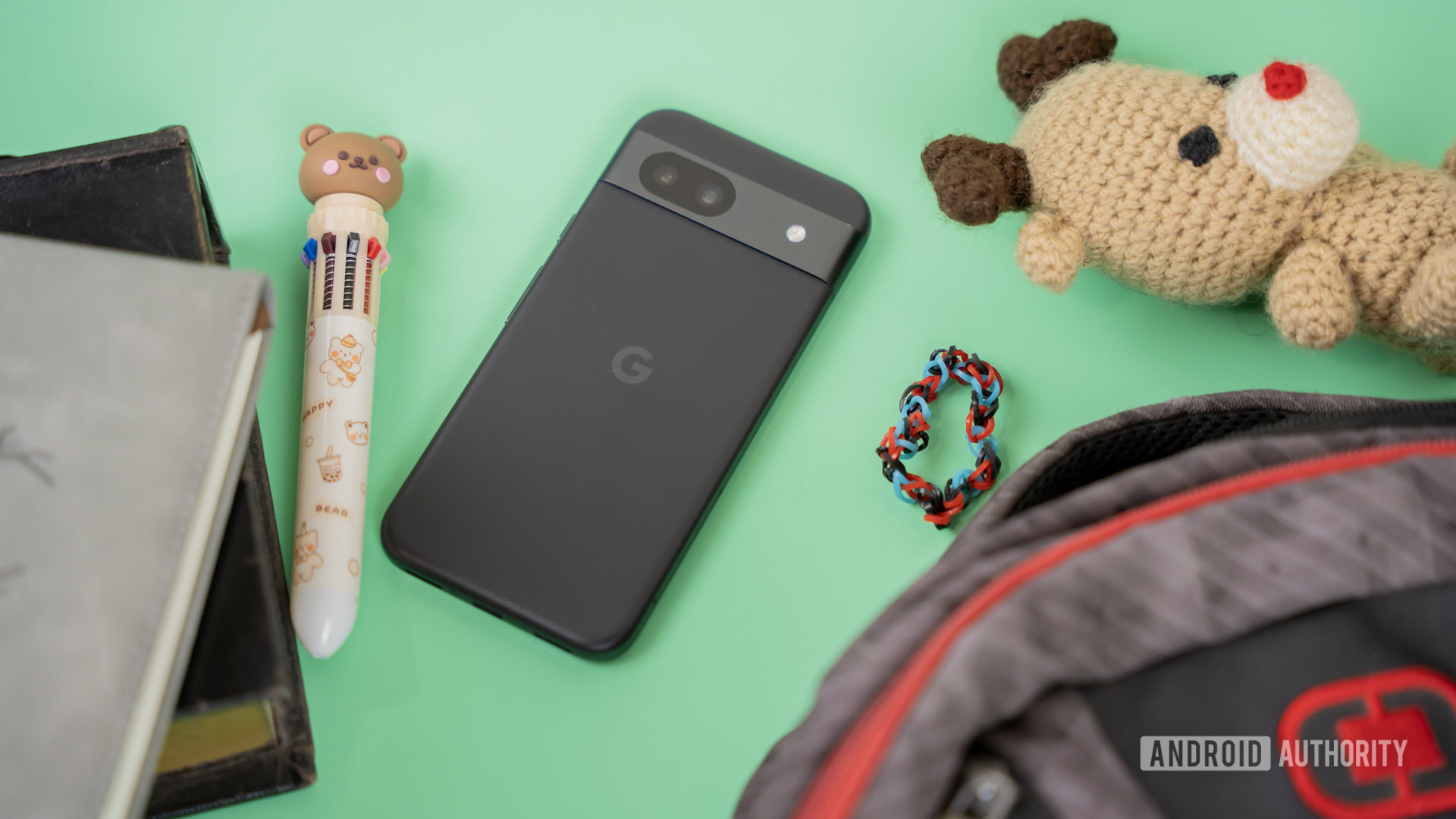 Smartphone next to kid school and random accessories 2